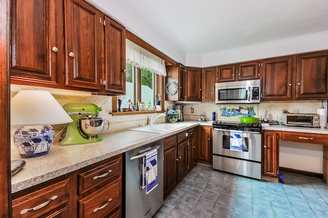 83 Colonial Way W, Falmouth, MA 02540 - kitchen with appliances with stainless steel finishes, a sink, light countertops, and decorative backsplash