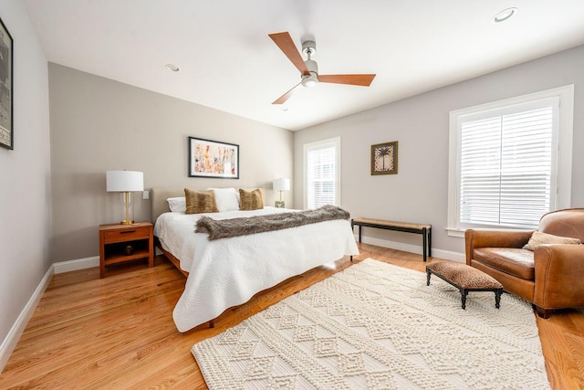 bedroom featuring a ceiling fan, light wood-type flooring, baseboards, and recessed lighting