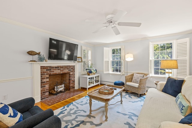 74 Deering Dr, Chatham, MA 02633 - living area featuring wood finished floors, ornamental molding, a baseboard heating unit, a ceiling fan, and a brick fireplace