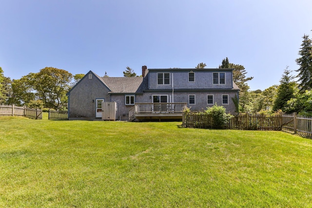 74 Deering Dr, Chatham, MA 02633 - rear view of property with a fenced backyard, a deck, and a chimney