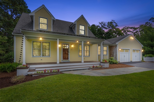 2 Julie Ln, Cotuit, MA 02635 - cape cod home featuring covered porch, driveway, a front lawn, and an attached garage