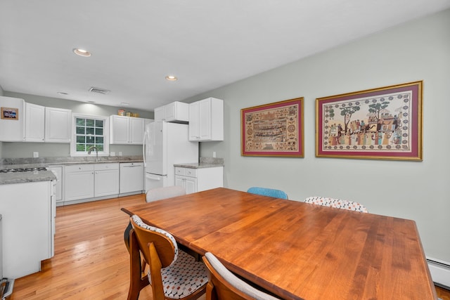 2 Julie Ln, Cotuit, MA 02635 - dining space with light wood-style flooring, a baseboard radiator, and recessed lighting