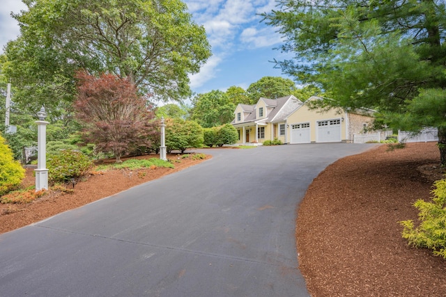 2 Julie Ln, Cotuit, MA 02635 - cape cod house with driveway and a garage