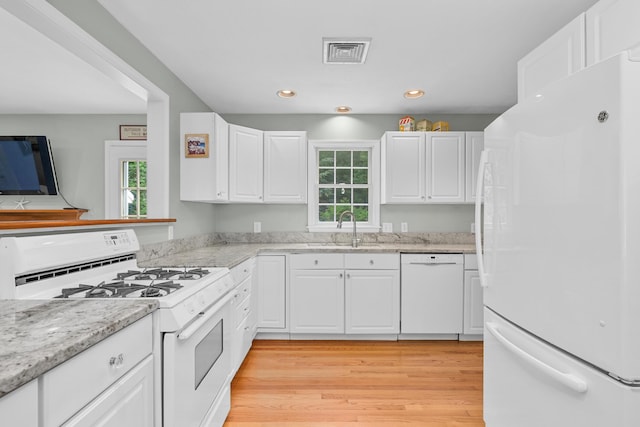 2 Julie Ln, Cotuit, MA 02635 - kitchen featuring white appliances, healthy amount of natural light, white cabinetry, and recessed lighting