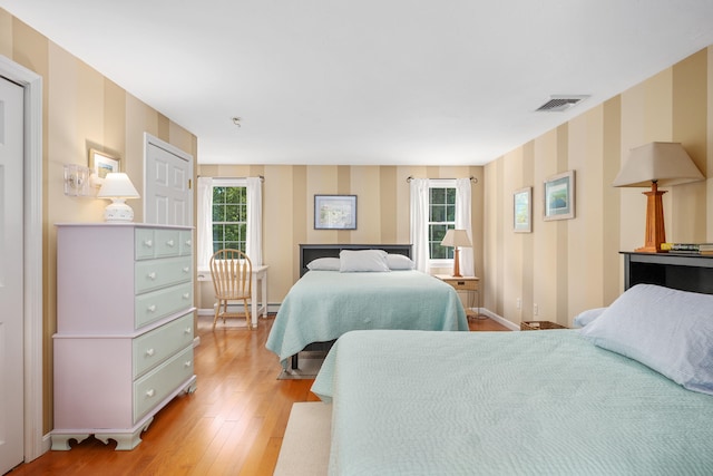 2 Julie Ln, Cotuit, MA 02635 - bedroom featuring light wood-style flooring and wallpapered walls