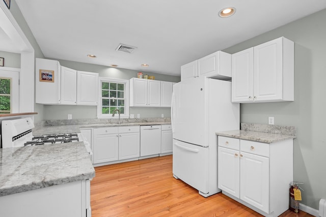 2 Julie Ln, Cotuit, MA 02635 - kitchen with white appliances, light wood finished floors, white cabinets, and recessed lighting