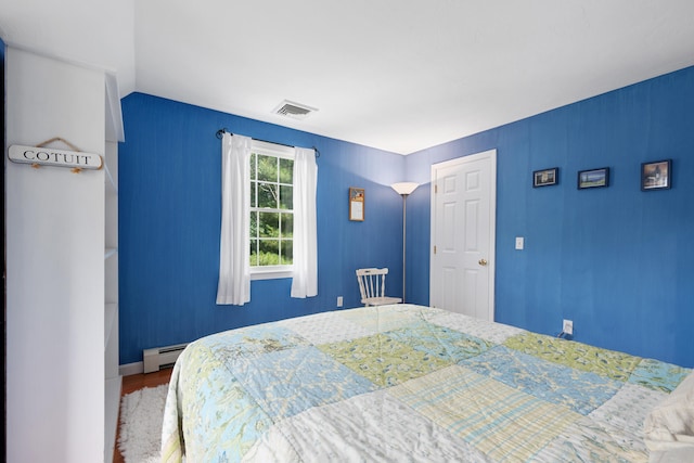 2 Julie Ln, Cotuit, MA 02635 - bedroom featuring wood finished floors and baseboard heating