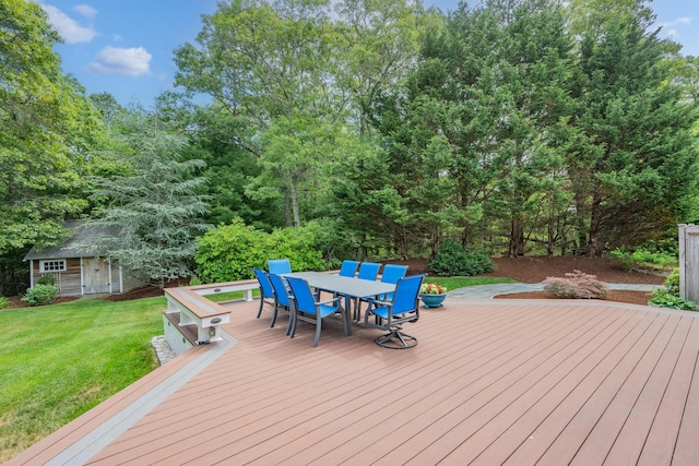 2 Julie Ln, Cotuit, MA 02635 - wooden deck with outdoor dining area, a yard, and an outbuilding