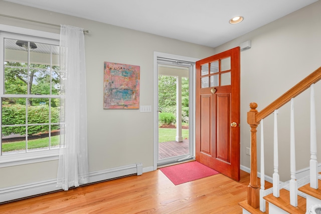 2 Julie Ln, Cotuit, MA 02635 - foyer entrance featuring baseboard heating, stairway, wood finished floors, and recessed lighting