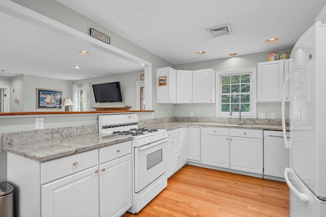 2 Julie Ln, Cotuit, MA 02635 - kitchen with white appliances, white cabinetry, a peninsula, recessed lighting, and light wood-style flooring