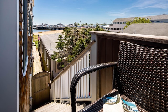 balcony featuring a water view