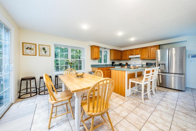 tiled dining area with sink