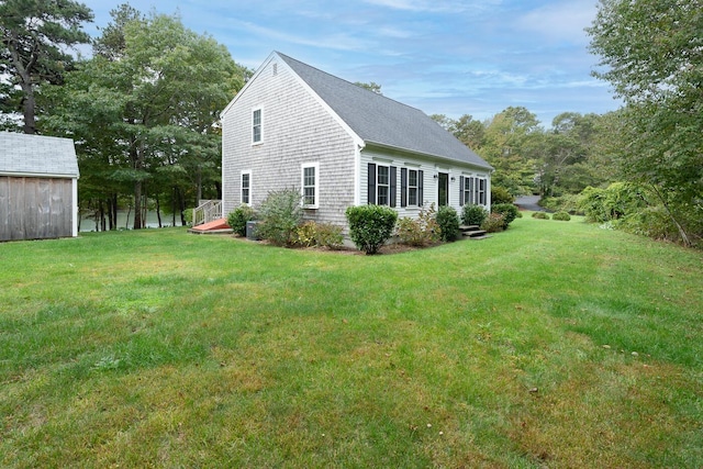 view of home's exterior with a yard