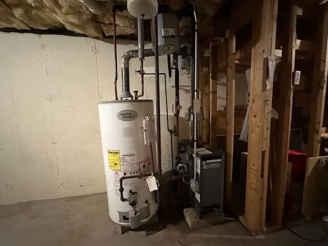 utility room with water heater