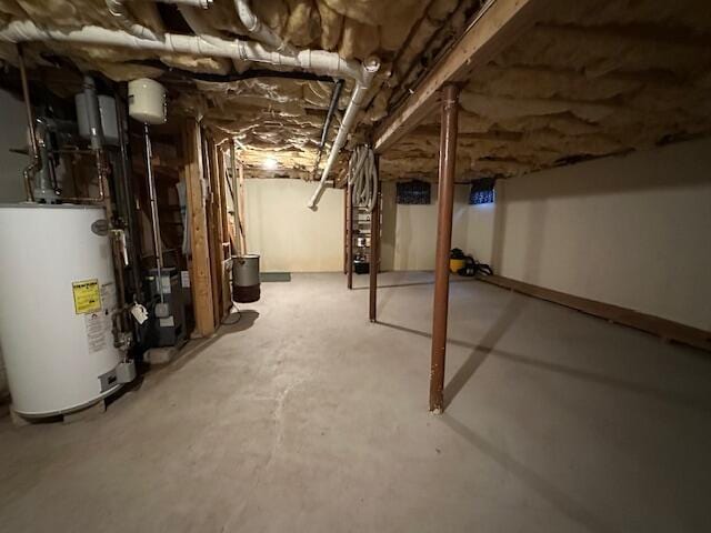 unfinished below grade area featuring gas water heater