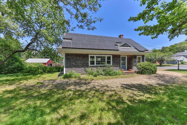 231 Crowell Rd, Chatham, MA 02633 - view of front facade with a front lawn and solar panels