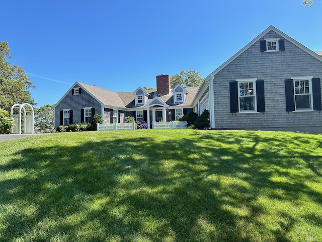 30 Tisquantum Rd, Chatham, MA 02633 - back of property featuring a chimney and a lawn