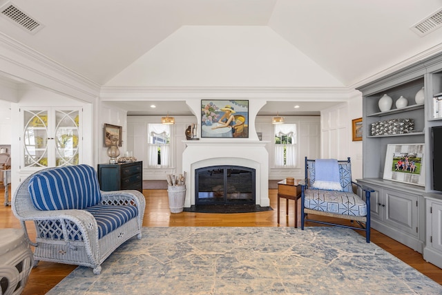 30 Tisquantum Rd, Chatham, MA 02633 - living room featuring lofted ceiling, wood finished floors, and a glass covered fireplace