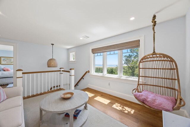 30 Tisquantum Rd, Chatham, MA 02633 - sitting room with an upstairs landing, wood finished floors, and recessed lighting