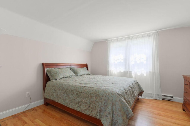 45 Green Pond Rd, East Falmouth, MA 02536 - bedroom featuring a baseboard radiator, light wood-type flooring, and vaulted ceiling