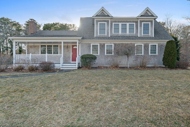 view of front of house with a front lawn, a porch, and roof with shingles