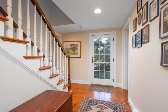 entrance foyer featuring recessed lighting, baseboards, and light wood finished floors