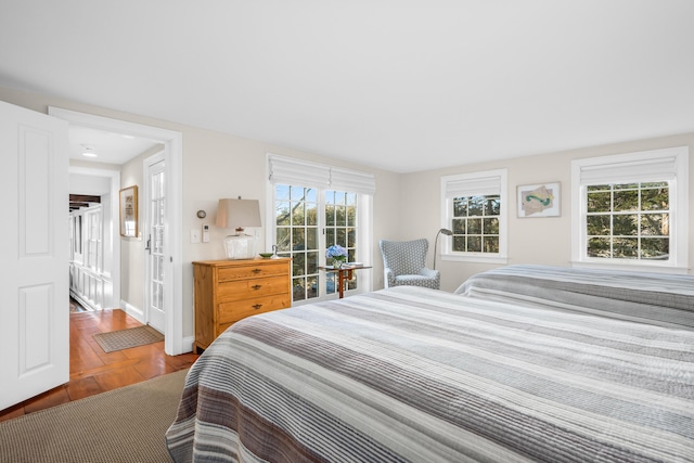 bedroom featuring baseboards and wood finished floors