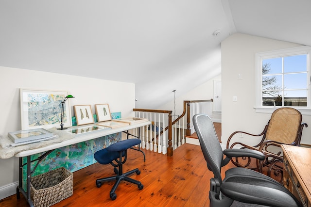 home office with baseboards and lofted ceiling