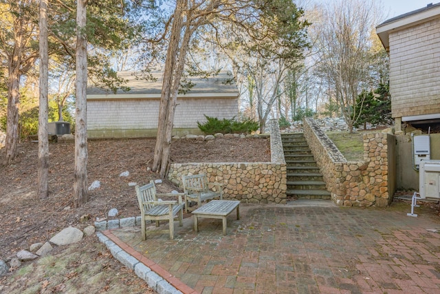 view of patio / terrace with stairway and central AC