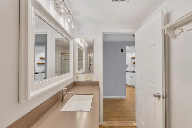 2124 Heatherwood, Yarmouth Port, MA 02675 - bathroom with wood finished floors and vanity