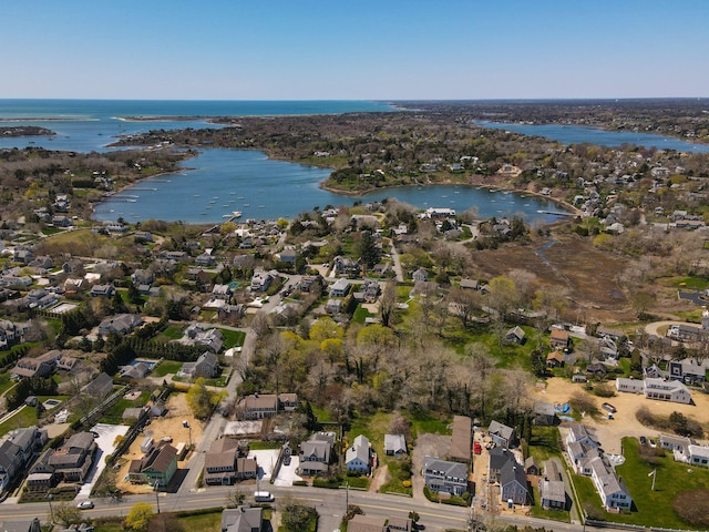 drone / aerial view with a water view and a residential view