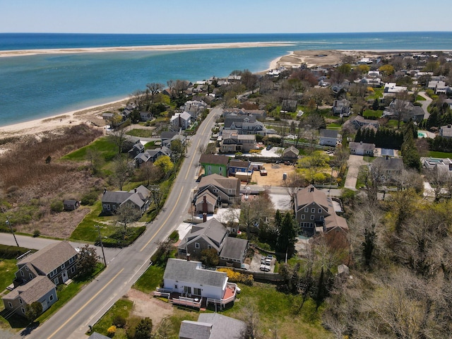 birds eye view of property with a water view and a residential view