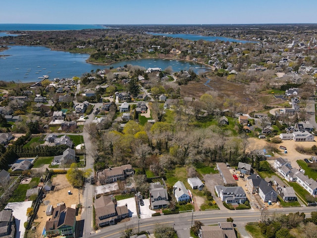 birds eye view of property with a residential view and a water view