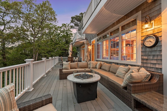 38 Captain Baker Rd, Brewster, MA 02631 - wooden terrace featuring an outdoor living space with a fire pit