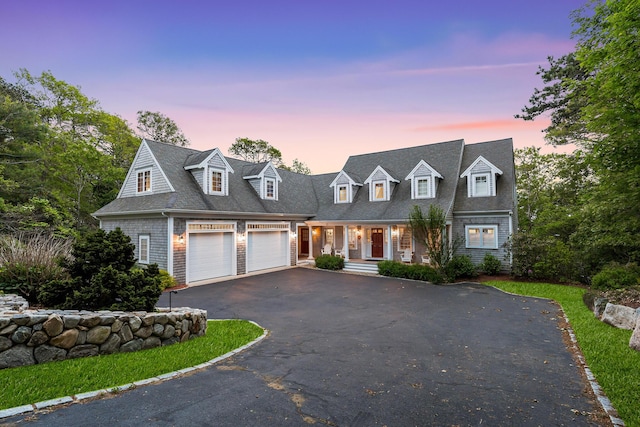 38 Captain Baker Rd, Brewster, MA 02631 - cape cod home with asphalt driveway, a porch, a garage, and roof with shingles