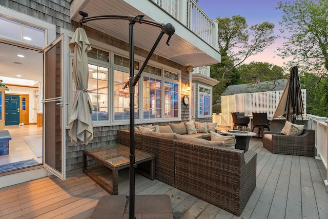 38 Captain Baker Rd, Brewster, MA 02631 - deck at dusk with an outdoor living space with a fire pit