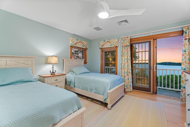 38 Captain Baker Rd, Brewster, MA 02631 - bedroom with access to outside, wood finished floors, and ceiling fan