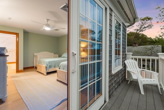 38 Captain Baker Rd, Brewster, MA 02631 - balcony at dusk with a ceiling fan