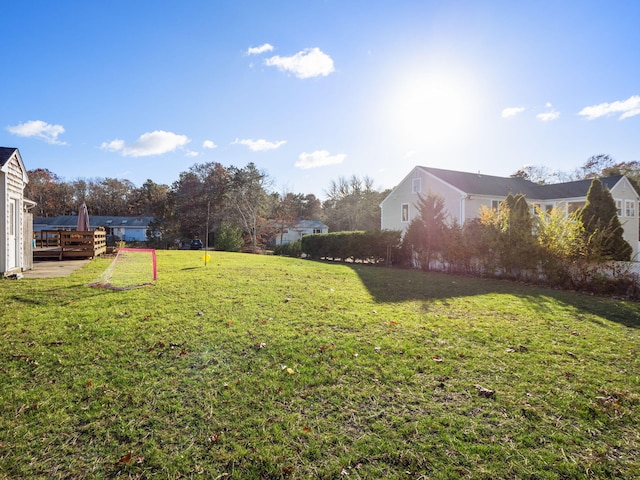 view of yard featuring a wooden deck