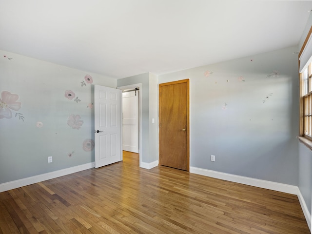 spare room featuring light hardwood / wood-style flooring