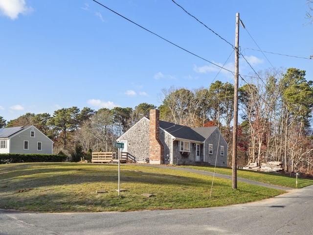 view of side of home featuring a yard