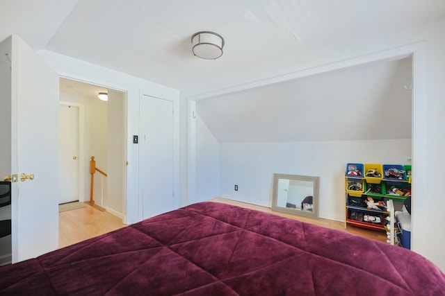 885 Sandwich Rd, Hatchville, MA 02536 - bedroom featuring vaulted ceiling, baseboards, and wood finished floors