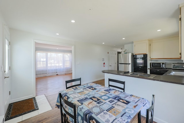885 Sandwich Rd, Hatchville, MA 02536 - dining space with recessed lighting, wood finished floors, and baseboards