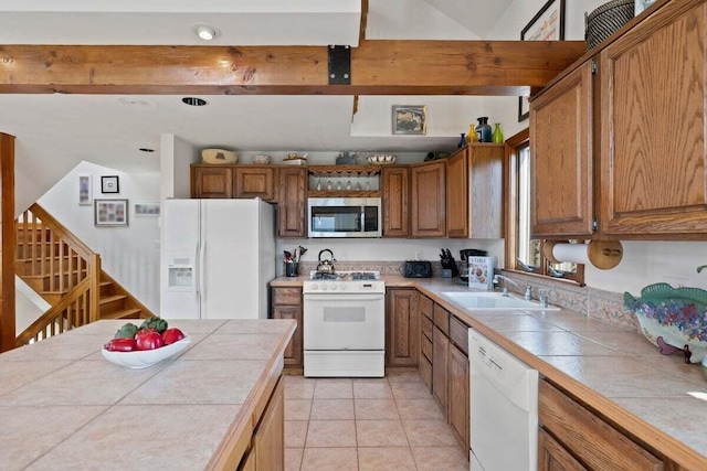 63 Swift Ln, Brewster, MA 02631 - kitchen with white appliances, tile countertops, and brown cabinets