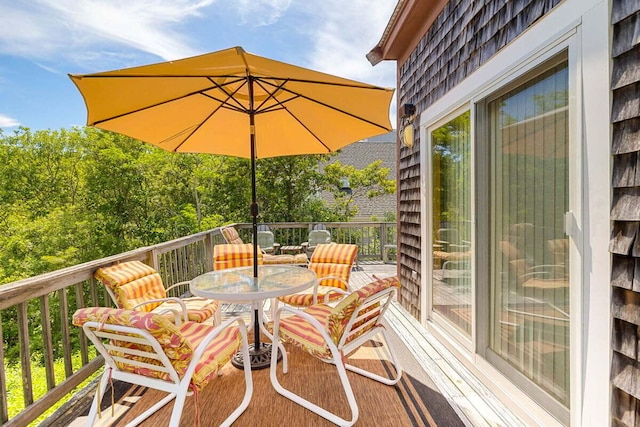 63 Swift Ln, Brewster, MA 02631 - wooden terrace featuring outdoor dining area
