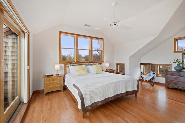 63 Swift Ln, Brewster, MA 02631 - bedroom with light wood-type flooring, lofted ceiling, multiple windows, and ceiling fan