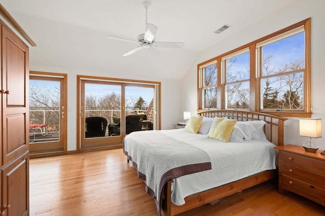 63 Swift Ln, Brewster, MA 02631 - bedroom with access to exterior, light wood finished floors, vaulted ceiling, and ceiling fan