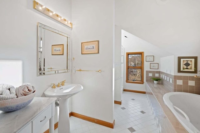 63 Swift Ln, Brewster, MA 02631 - bathroom featuring a garden tub, vaulted ceiling, and tile patterned floors