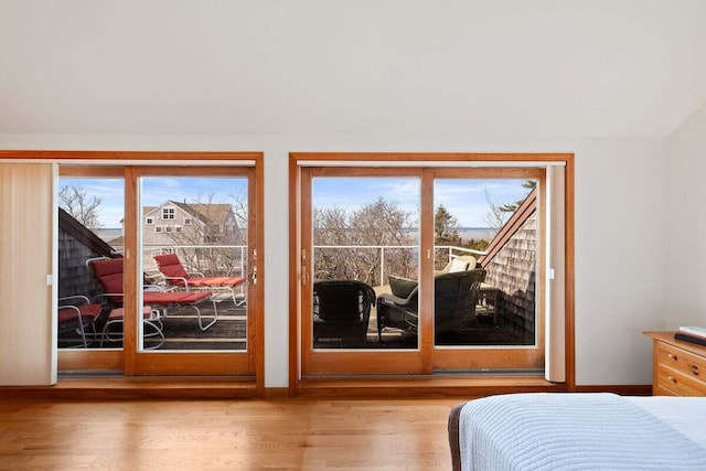 63 Swift Ln, Brewster, MA 02631 - bedroom with access to exterior and wood finished floors