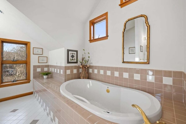 63 Swift Ln, Brewster, MA 02631 - bathroom featuring lofted ceiling, a garden tub, and tile patterned flooring